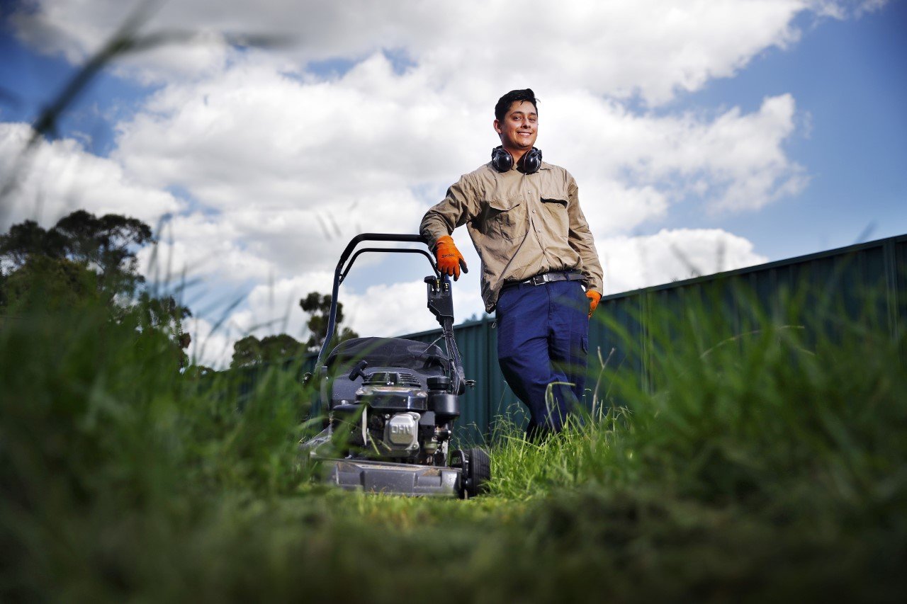 Home Daniel mowing a lawn with his mower